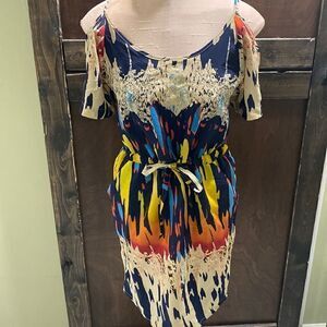 Off the shoulder Retro Dress with tie waist, pockets, & back cut out accent.